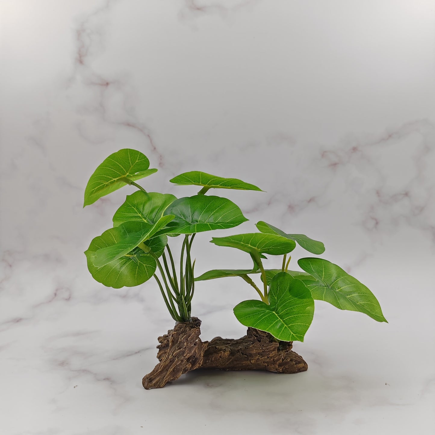 Individual driftwood with green leaves made from ABS material, ideal for aquarium decor