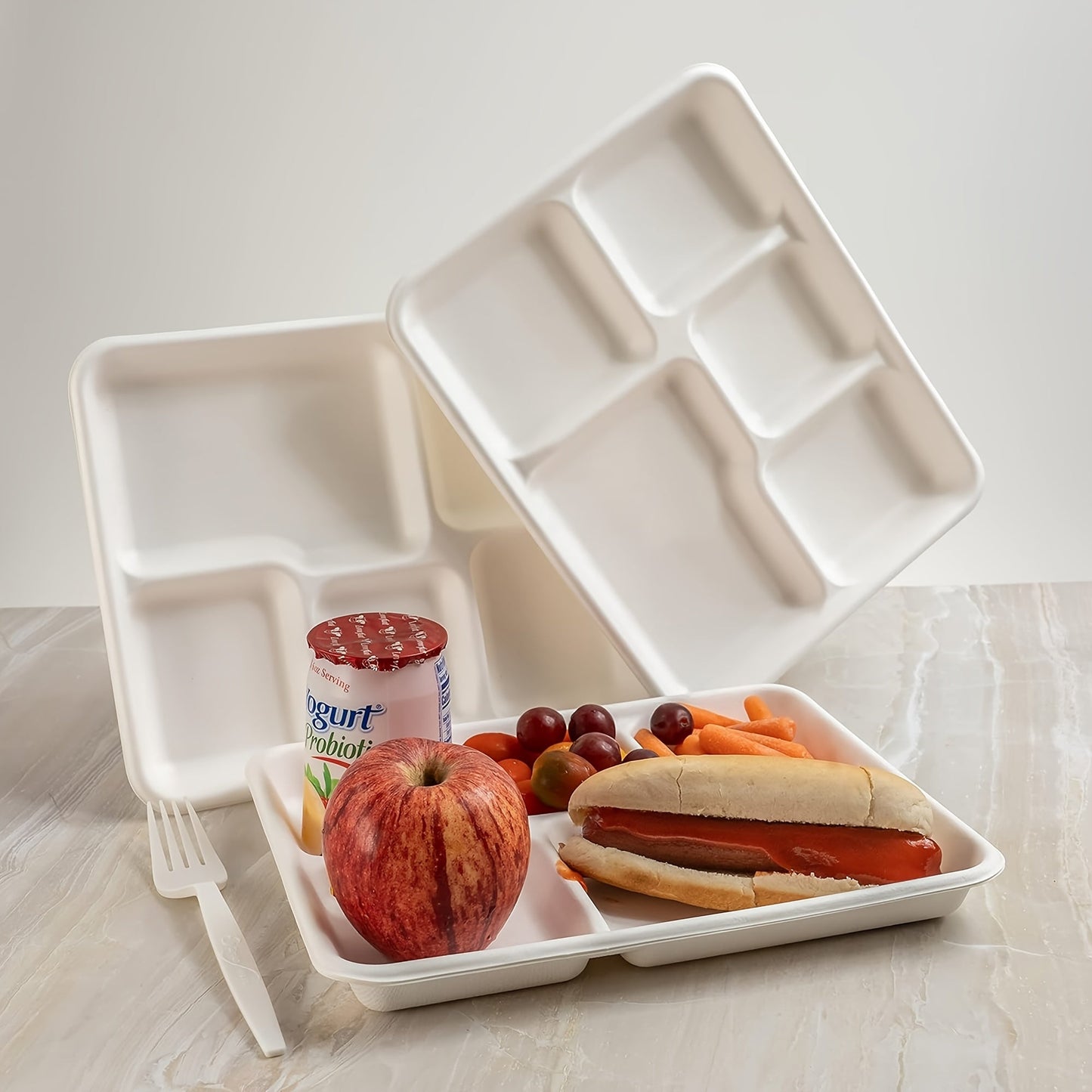 EcoChoice offers a 50-Pack of Compostable Dinner Plates with 5 Compartments, made from Biodegradable Sugarcane Fiber. These Rectangular Trays are perfect for Parties, Picnics, BBQs, and Kitchen Supplies.