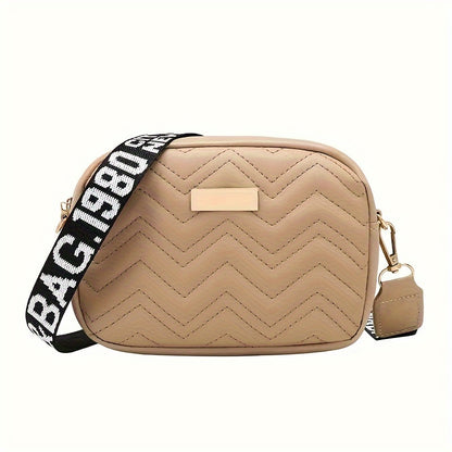 Women's fashion crossbody bag made of stain-resistant synthetic leather with removable strap. Available in khaki, white, and black. Zippered camera bag design.