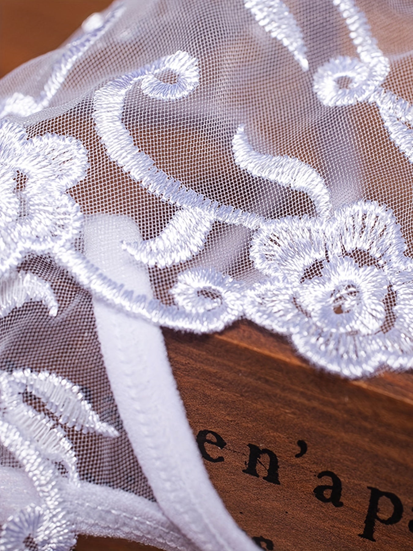 Seductive white crotchless panties with embroidered mesh for women, retro design, transparent and low-waisted t-shorts.