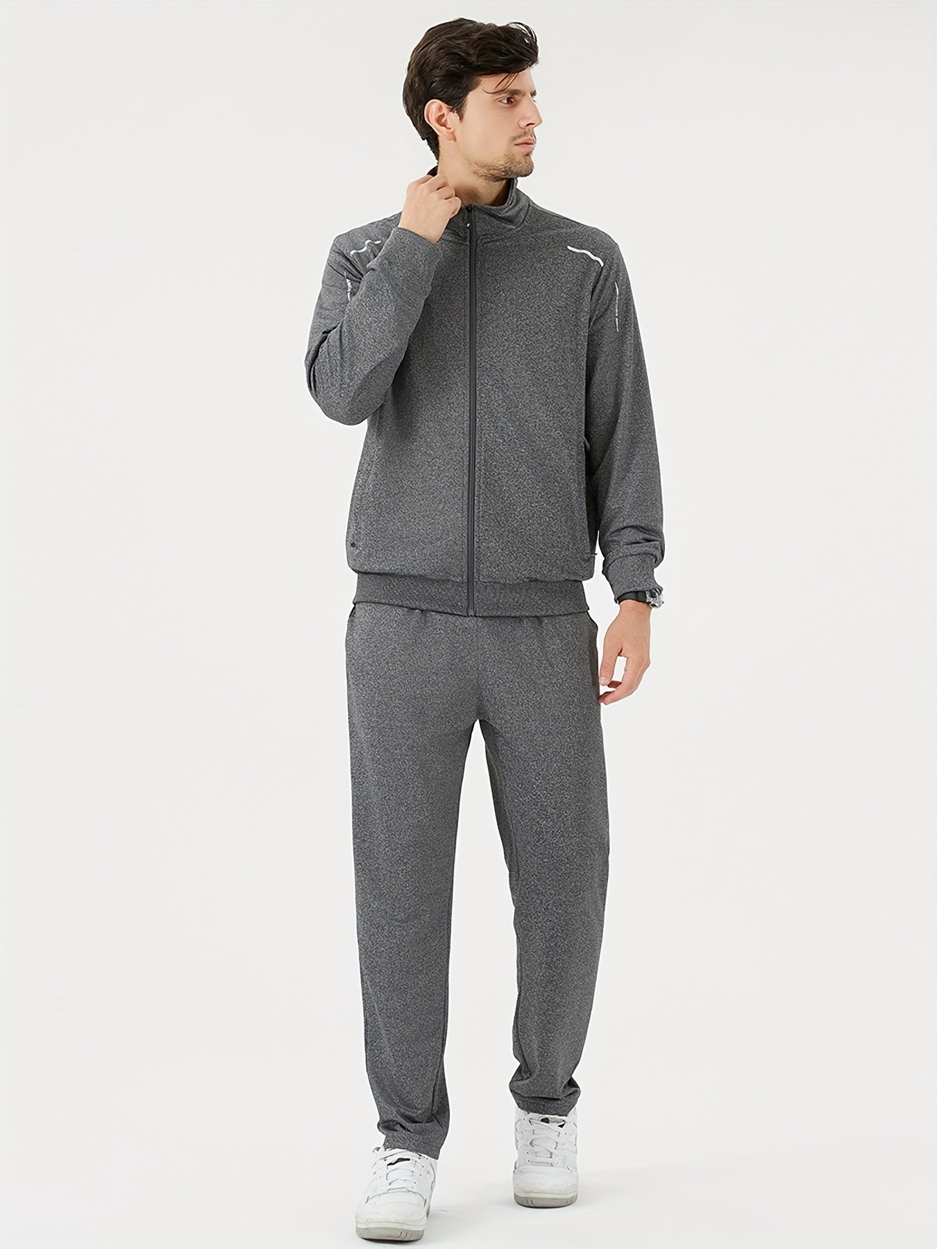 Men's athletic tracksuit set with zip-up jacket and jogging pants for gym workouts and running.