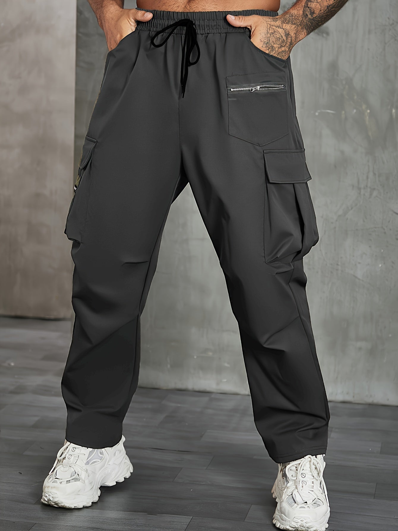 Men's solid cargo pants in plus sizes for spring and fall outdoor sports.