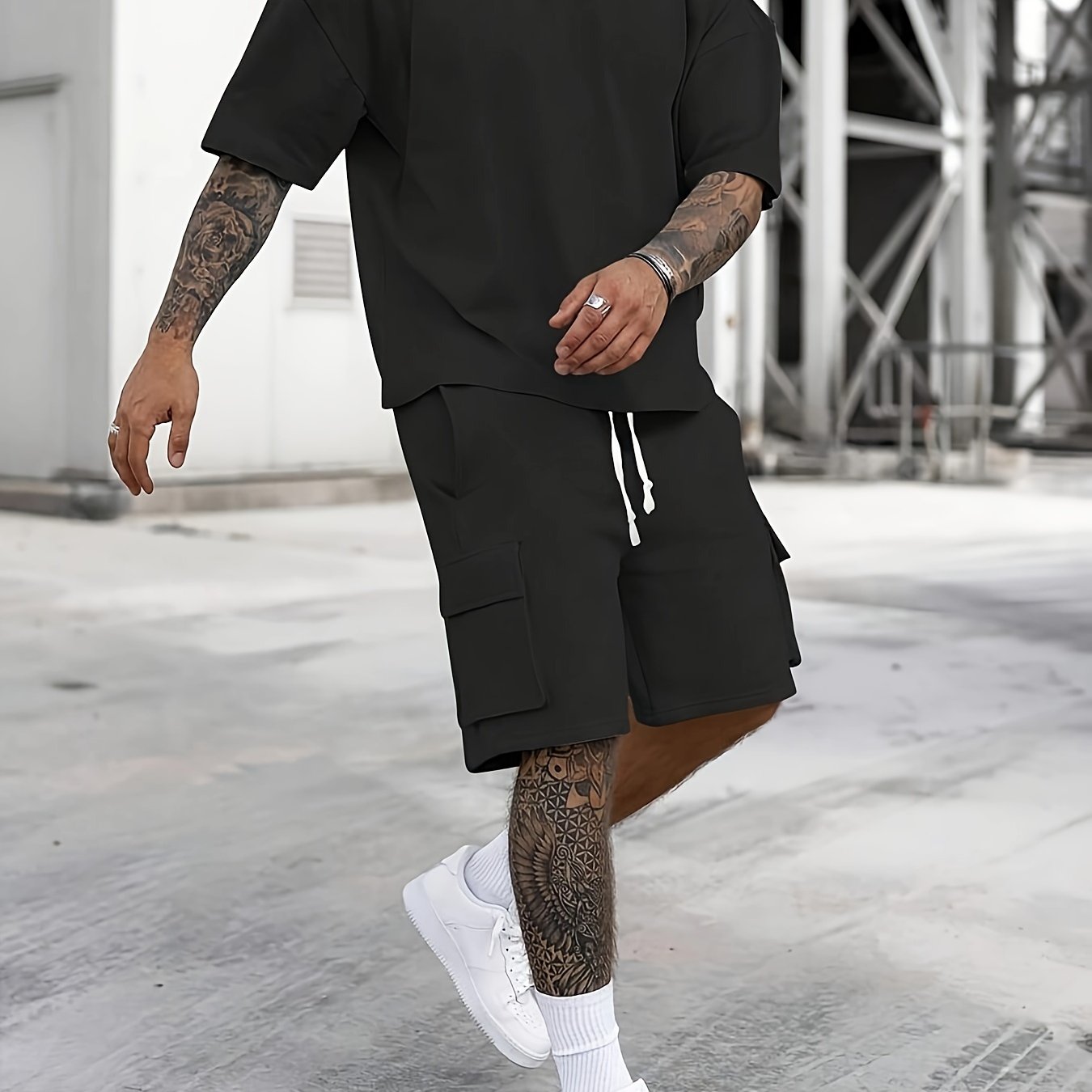 Men's casual sportswear set includes polyester t-shirt and drawstring shorts with pockets, ideal for summer and machine washable.