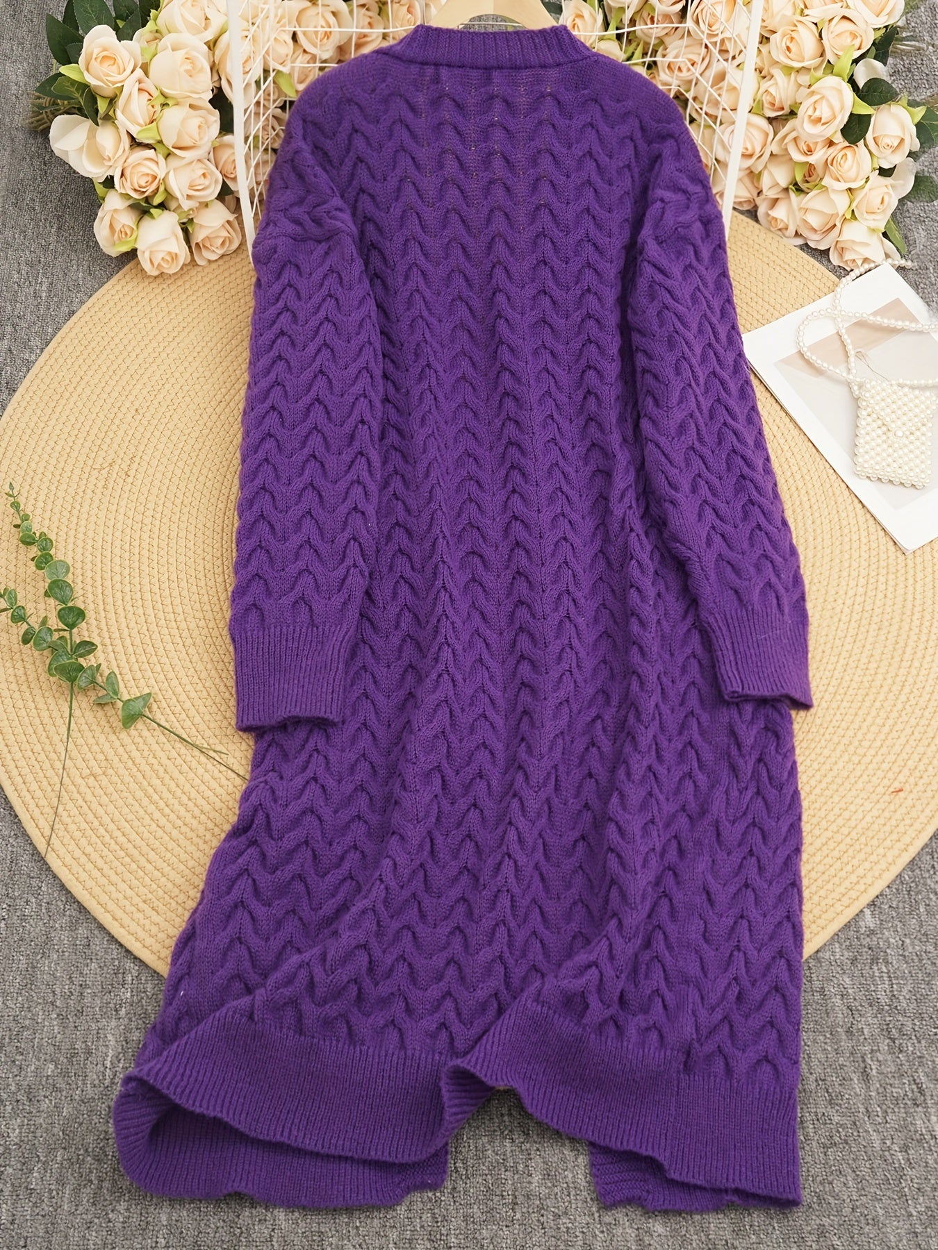 Stylish women's purple cable-knit cardigan with long sleeves, V-neck, and button-up closure. Made of 100% polyester, ideal for fall and winter.