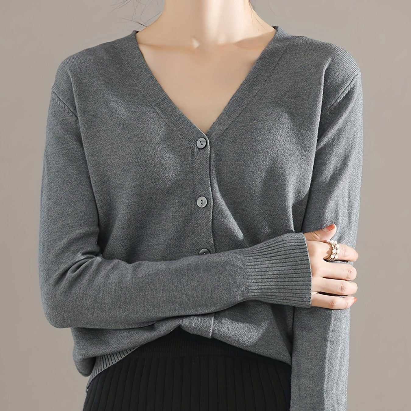 Chic V-neck cardigan with long sleeves, perfect for spring and fall.