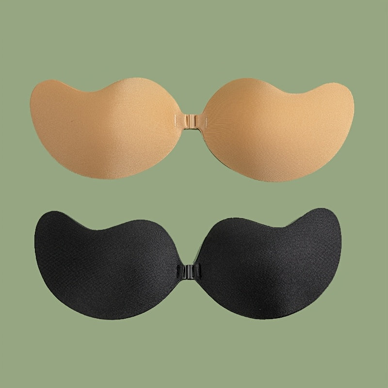 2 pairs of self-adhesive, strapless lifting bras with slip-proof design for women. Mango shaped straps, polyester & silicone blend. Hand wash only. Ideal for vests & dresses.