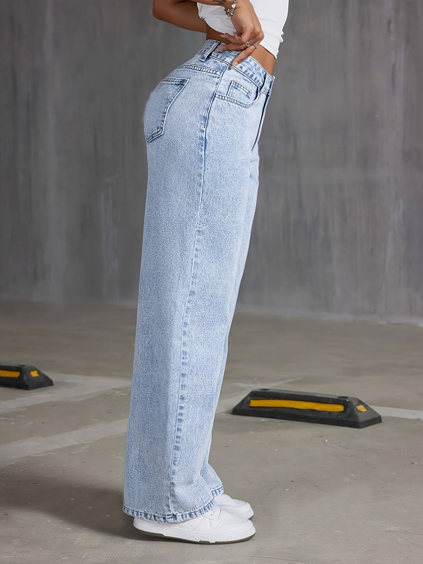 Preppy style high-waisted wide leg denim jeans for women, with button detail and solid color, perfect for all-season weekend wear.