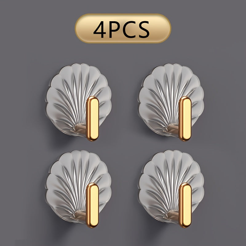 Set of 4 elegant gold-plated shell hooks, transparent and waterproof. Easy to install without drilling, high load-bearing for kitchen and bathroom doors.