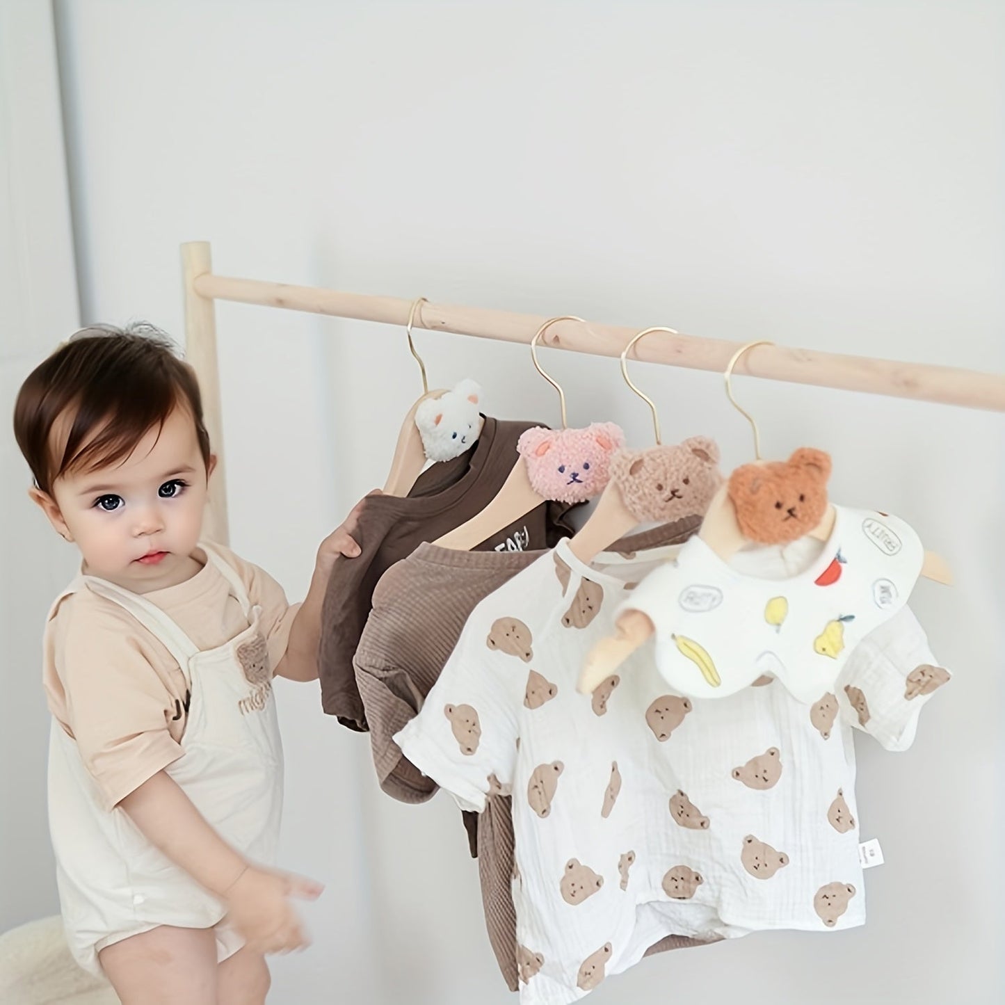 Durable and Lightweight Wooden Clothes Hangers featuring a Nordic Style Cartoon Bear Design, with Swivel Hooks for easy maneuvering. Recommended for Ages 14 and up.