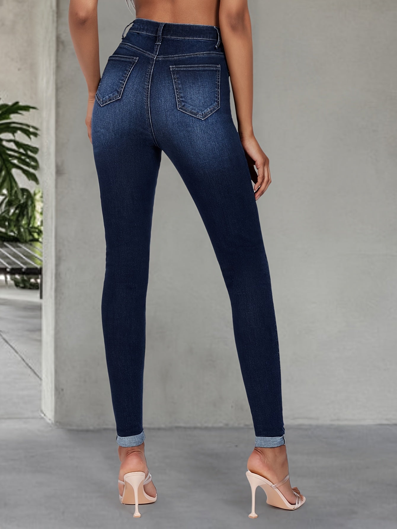 Elegant high stretch skinny jeans for women, long length with button detail, perfect for all seasons.