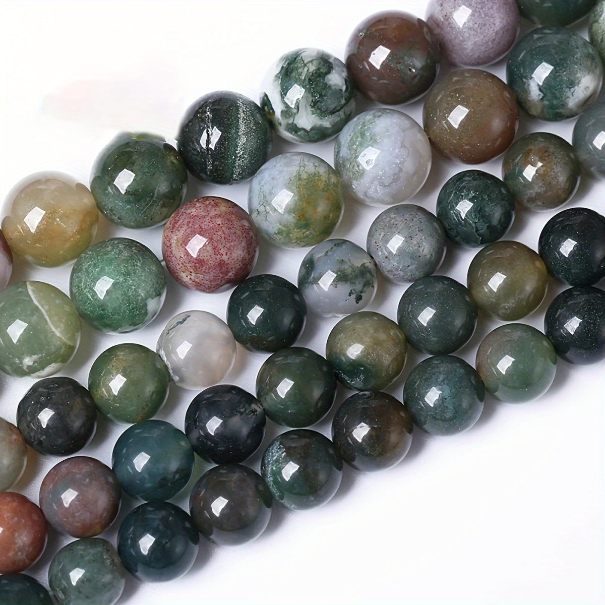 Indian Agate Round Loose Spacer Beads available in natural stone, perfect for DIY bracelet making. Each strand measures 15 inches in length with bead sizes of 4, 6, 8, 10, and 12mm. Ideal for creating unique jewelry accessories.