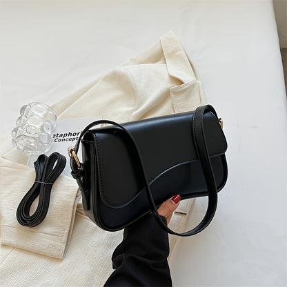 Stylish black crossbody bag with adjustable strap for casual and formal occasions.