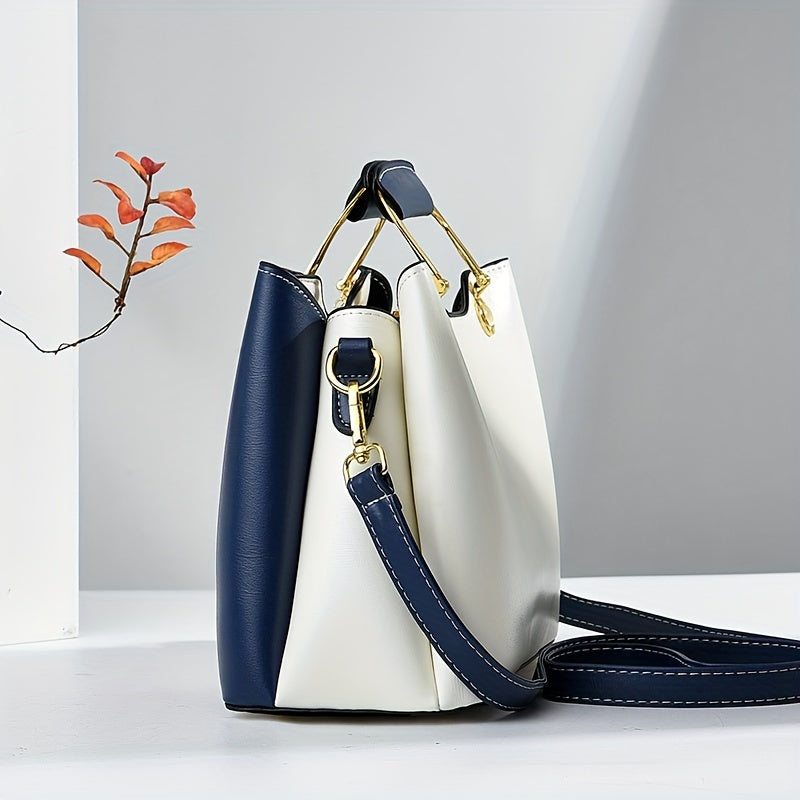 Chic navy blue, white, and beige colorblock tote with golden hardware, adjustable strap, magnetic closure, spacious interior, and lightweight design - perfect for daily use.