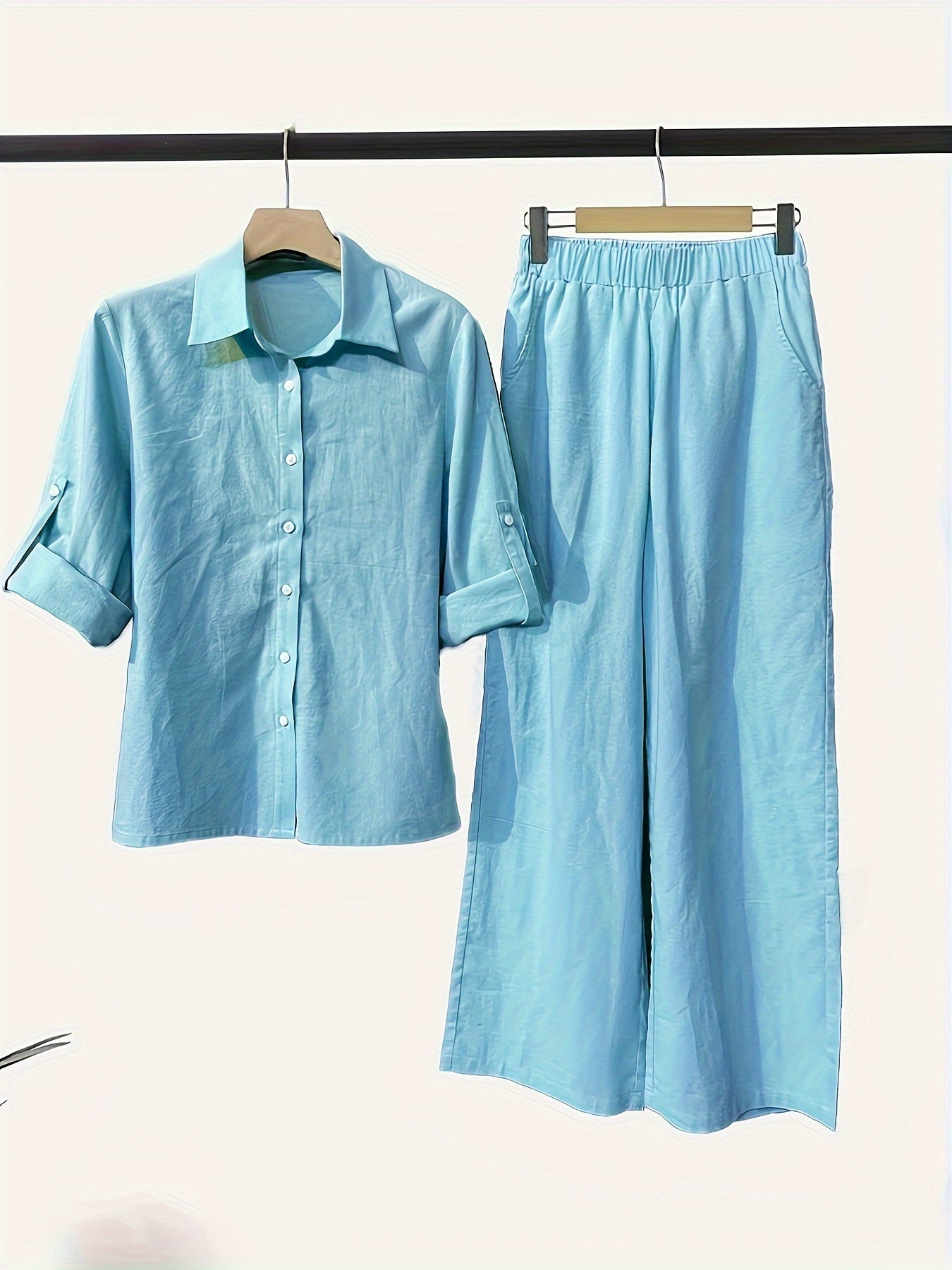 Women's casual chic two-piece set includes a long sleeve button-up shirt and wide-leg pants in a solid color. Machine washable for convenience.