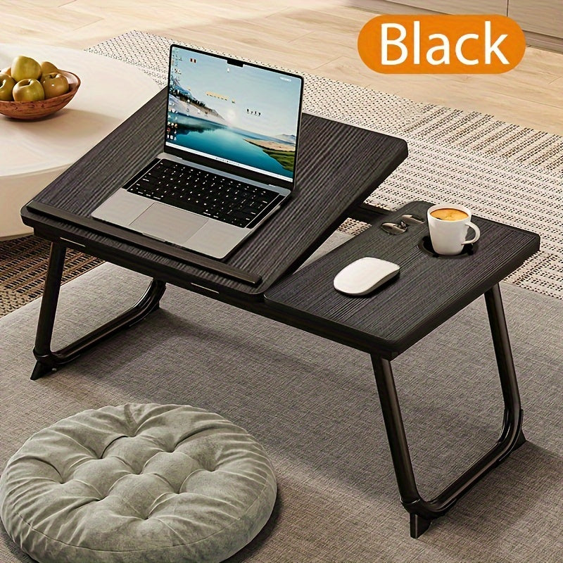 Folding desk with 5-level adjustment, cup holder, anti-slip feet in sleek black/white. Suitable for laptop, study, office, or bedside use.