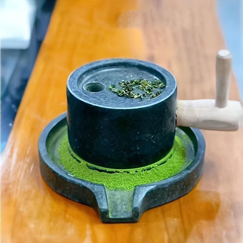 Handcrafted bluestone grinder for tea, coffee, and pepper, along with a matching handmade tea set and stone grinder for matcha. A perfect addition to any household's collection of tea grinding utensils, complete with beautiful graphite ornaments.