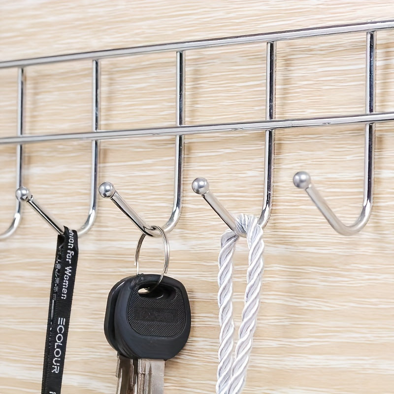 This Stainless Steel Hook Rack features 5 hooks, perfect for hanging behind doors, on cabinet doors, or on walls. Made of durable stainless steel, it is versatile and can be used for hanging towels behind living room doors or clothes in bedrooms. It is