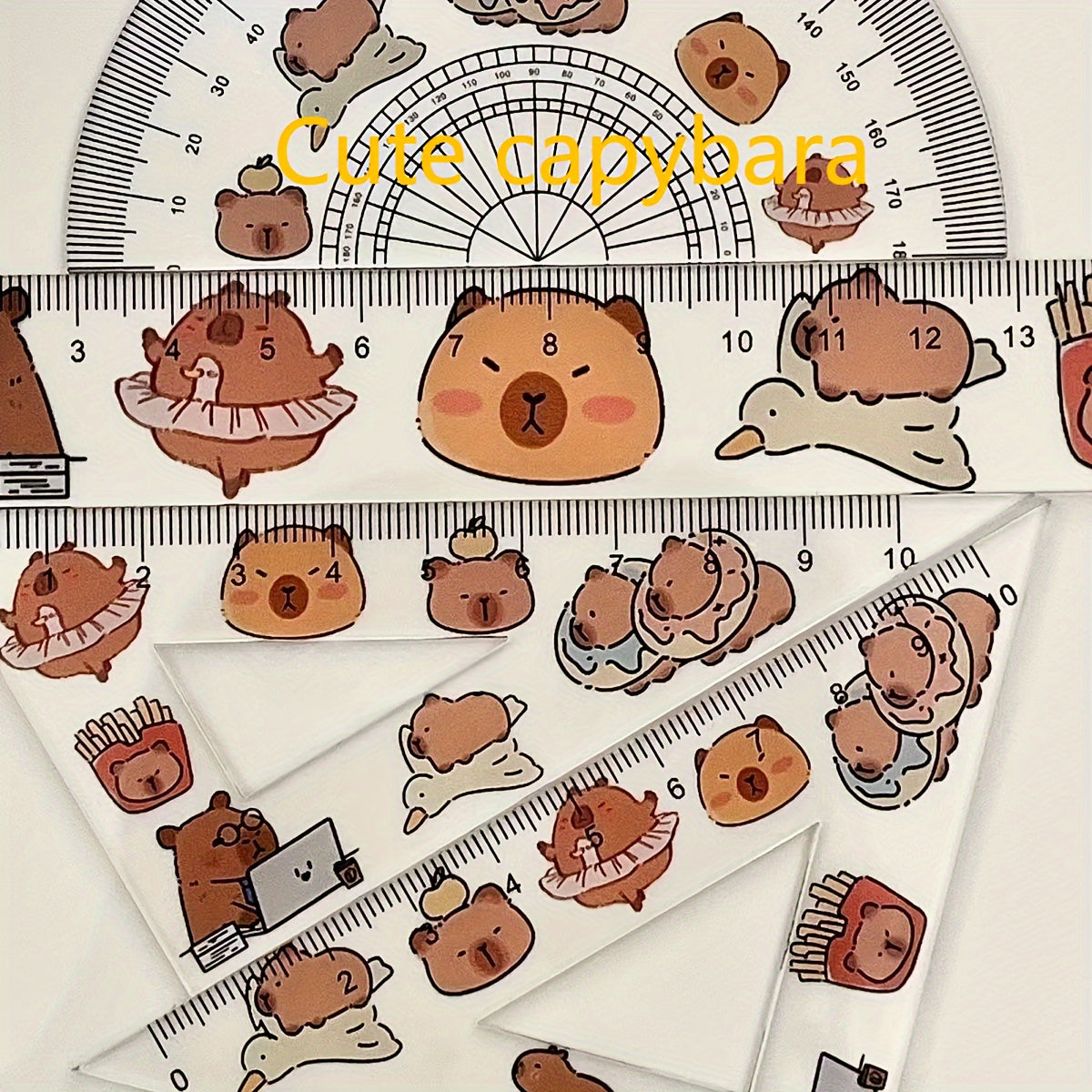 One set of 4 plastic transparent Capybara-themed rulers for drawing tests, including a triangle ruler board. Cute kawaii stationery for school supplies.