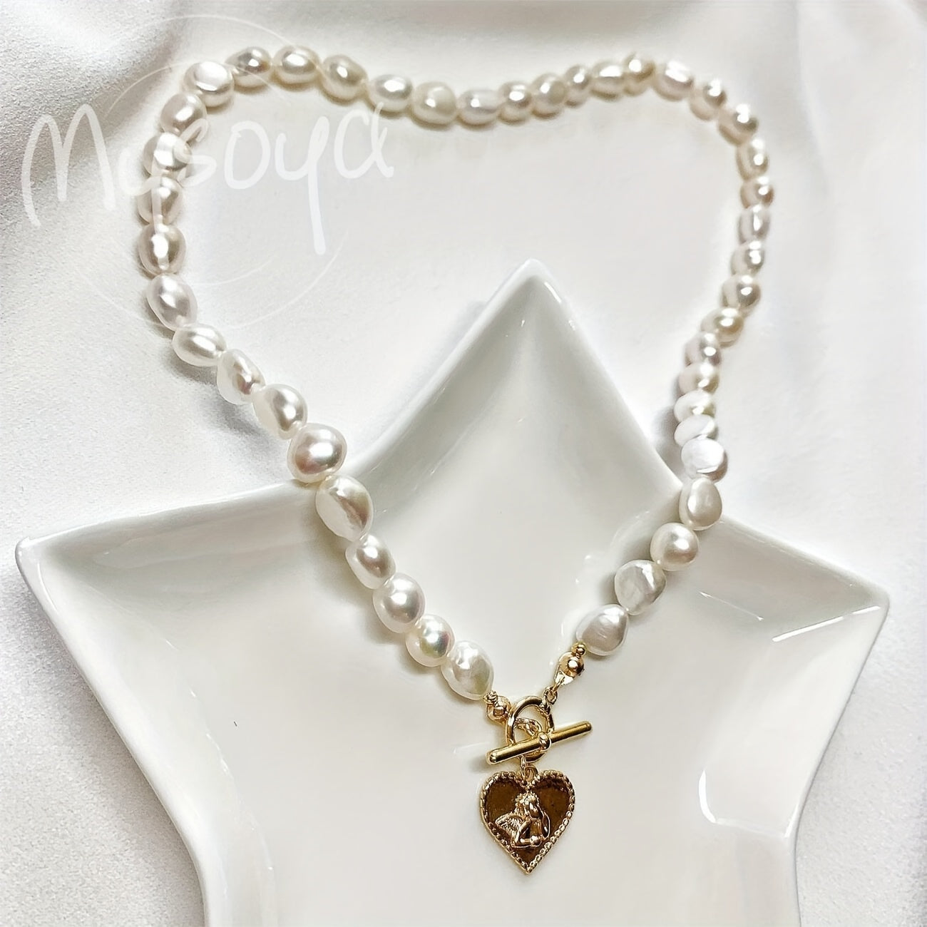 This elegant necklace features a handcrafted Baroque freshwater pearl with a golden heart pendant. Measuring 7-8mm, it comes in a beautiful gift box, making it a perfect gift for birthdays, anniversaries, Valentine's Day, and any special occasion.