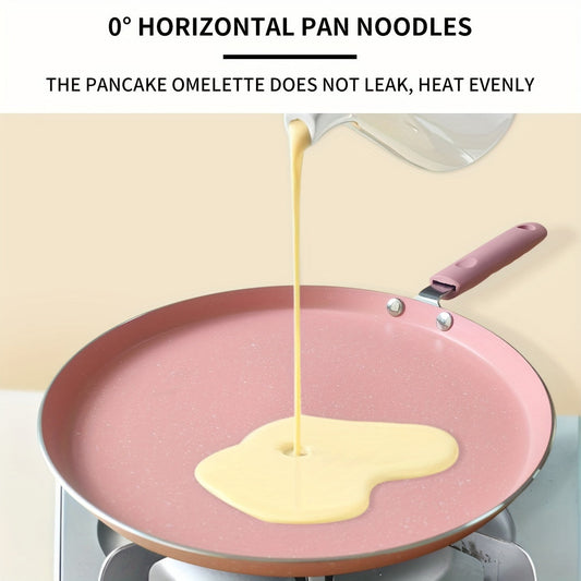 Non-stick aluminum frying pan with pink mica stone finish and wooden handle. Dishwasher safe and compatible with electric coil stoves. Perfect for cooking pancakes and eggs without the need for electricity.