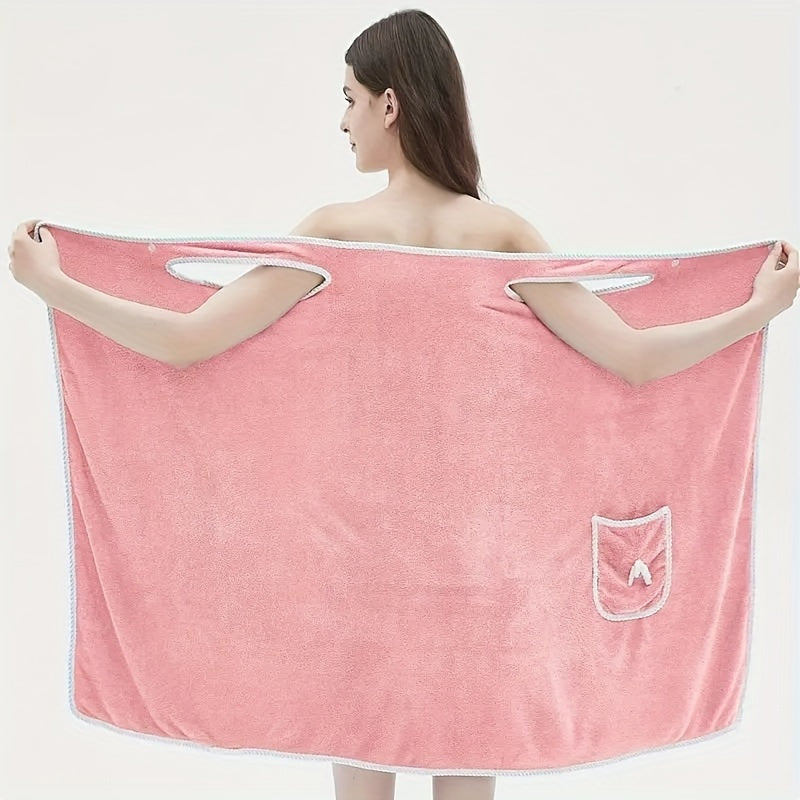 Soft coral velvet wearable bath towel with bow detail, ideal for bathroom and beach use. Thich, absorbent, quick-dry, pink with white border. Durable woven texture. Perfect for everyday comfort.