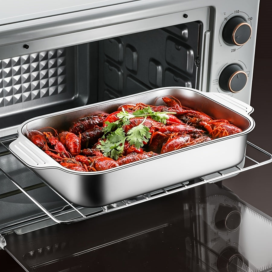 One piece of stainless steel deep baking sheet for non-stick cooking, grilling, and baking in the oven, with a selection of kitchen gadgets and accessories.