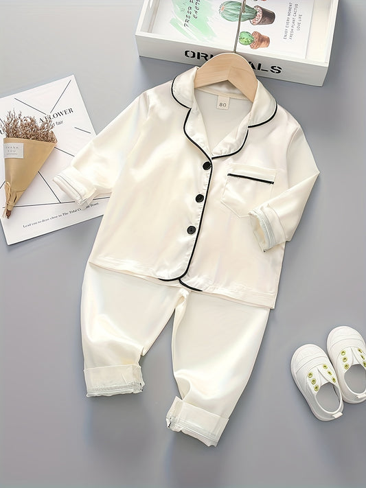 Boys' classic long sleeve pajama set made with polyester, featuring a lapel collar, button front, and regular fit for spring/fall.