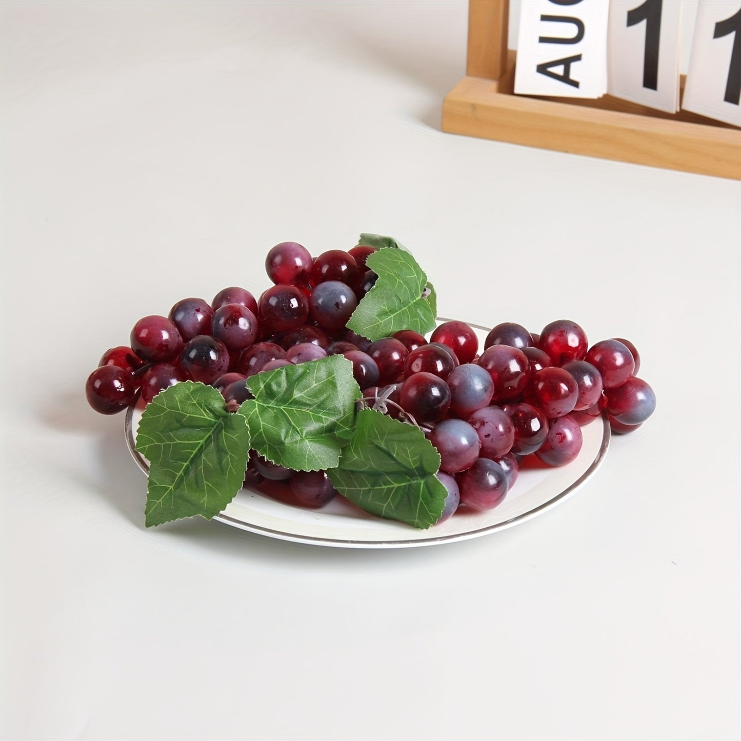 A string of artificial grapes with 36 large beads per string can be hung up for Halloween and Thanksgiving parties, as well as for weddings, kitchen displays, and Christmas gifts.