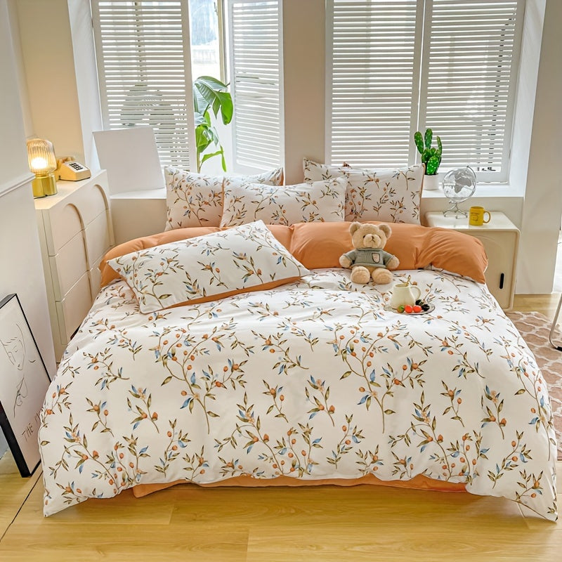 Orange flower and fruit plant pattern quilt cover set includes 1 quilt cover and 2 pillowcases in a pastoral style. Made from comfortable and skin-friendly material, it is non-ball and can be machine washed. Available in single, double, standard, and