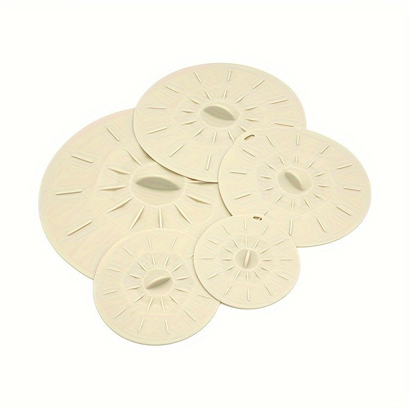 5 reusable silicone microwave lid covers in various sizes for bowls, cups, plates, pots, and pans. Can be used as microwave splatter covers, for stovetop, oven, fridge, and freezer. BPA free.