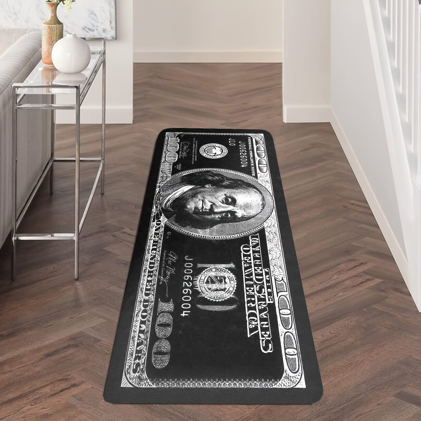 Transform your hallway with this stylish 1-piece Dollar Bill Runner Carpet in black and white. Perfect for adding a modern touch to your kitchen decor or bedroom, this non-skid rug is sure to enhance your home's ambiance.