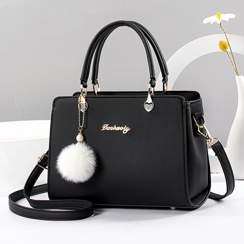 Women's stylish faux leather handbag with tassel embellishment, adjustable strap, zipper closure, and polyester lining. Available in multiple colors.