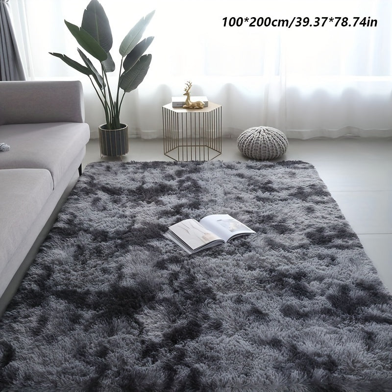 Long fleece carpet in a dark grey tie dye gradient, perfect for the living room coffee table or bedroom decor. This washable mat is fully padded and makes a great Halloween or Christmas gift.