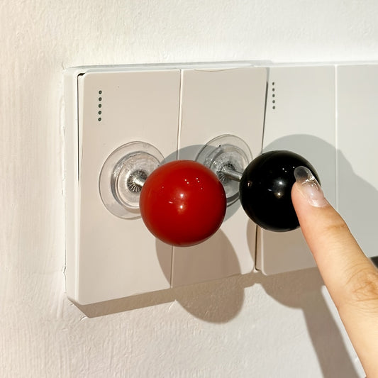 Modern lever ball switch sticker for light switch, drawer handle, toilet pusher - no battery needed, easy stick-on design.