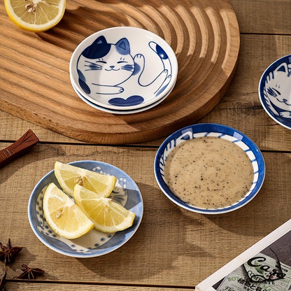 4 Japanese ceramic dessert plates and sauce dishes with a cute cartoon Lucky Cat pattern, suitable for home kitchens, restaurants, and hotels.