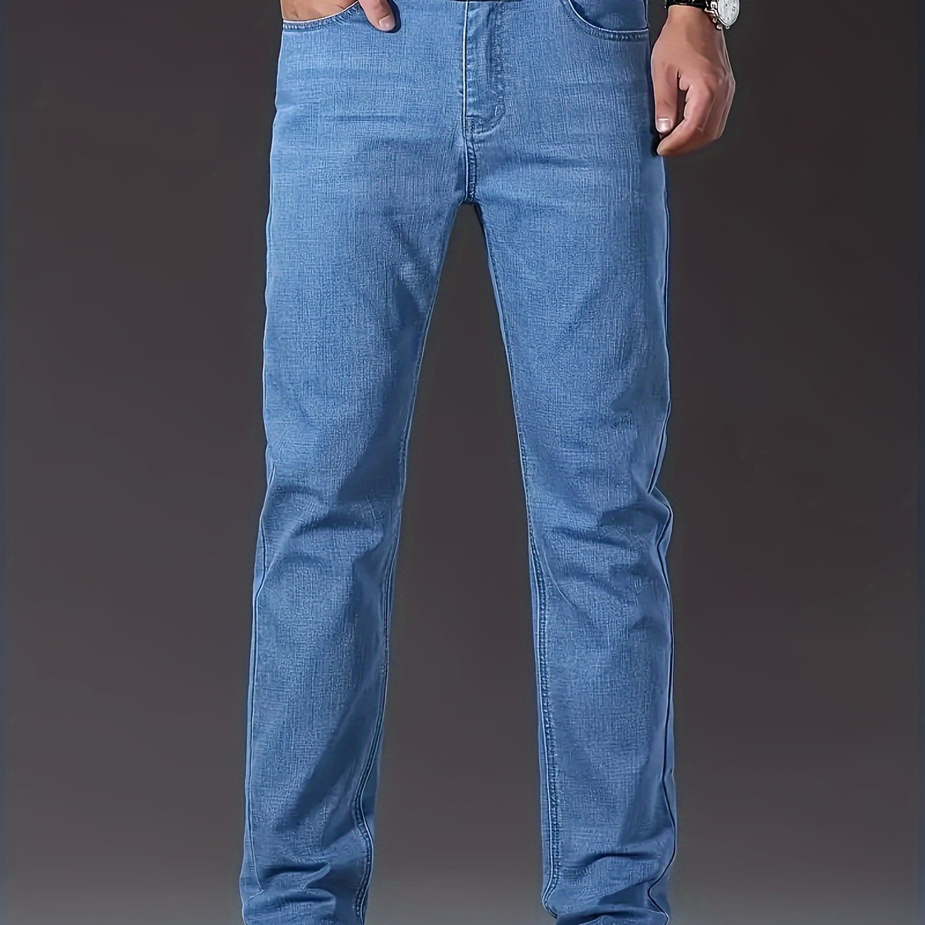 Casual solid denim pants for men with pockets, made from a cotton blend for outdoor activities.