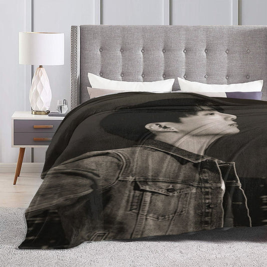 Stay cozy and stylish with the K-pop Idol themed printed flannel blanket. This contemporary design offers all-season comfort with its 250-300gsm knit fabric. Made from polyester and featuring a digital print, this blanket is perfect for use in your car