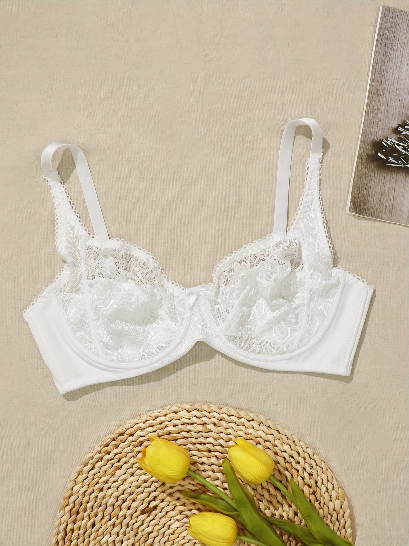 Plus-size white lace bra for women with floral cut-out design, underwire support, and hand washable.