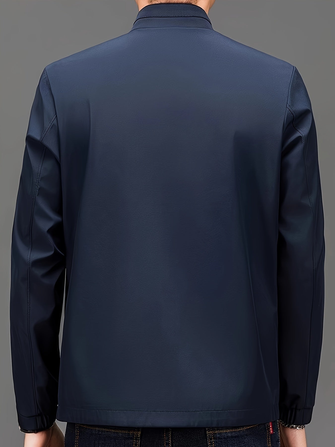 Men's stand collar jacket made from 100% polyester woven fabric in a solid color. Features a regular fit and zipper closure, suitable for spring/fall wear. Fashionable outerwear for