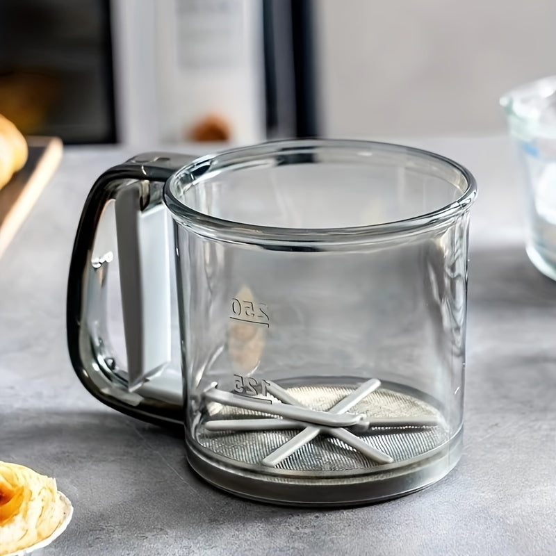 1 piece of a semi-automatic flour sifter with a 2-cup capacity and hand press design. Made of BPA-free materials, this flour sieve is a must-have baking tool and kitchen gadget.