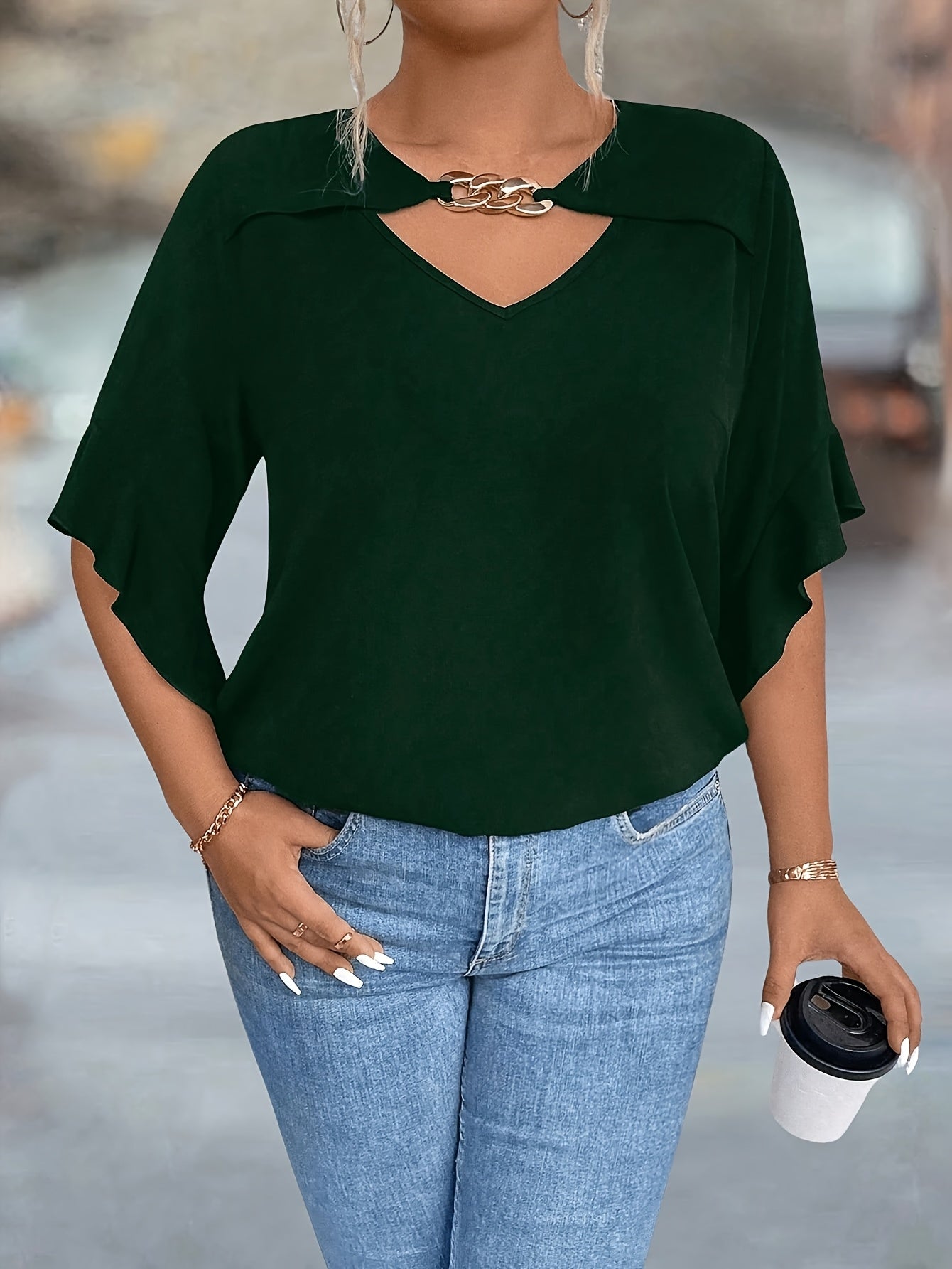 Stylish black V-neck tops for plus-size women in new summer collection.