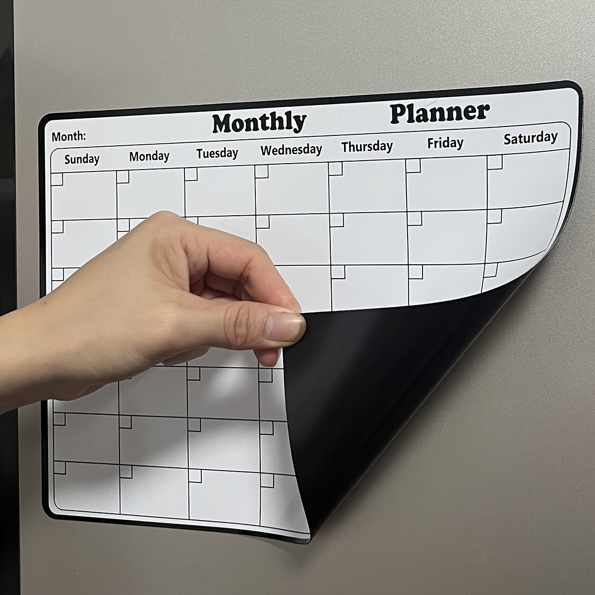 One piece of a dry erase fridge magnetic calendar, featuring a white board design perfect for refrigerators. This magnetic calendar is great for keeping track of appointments and events in the kitchen, serving as a decorative and functional addition to