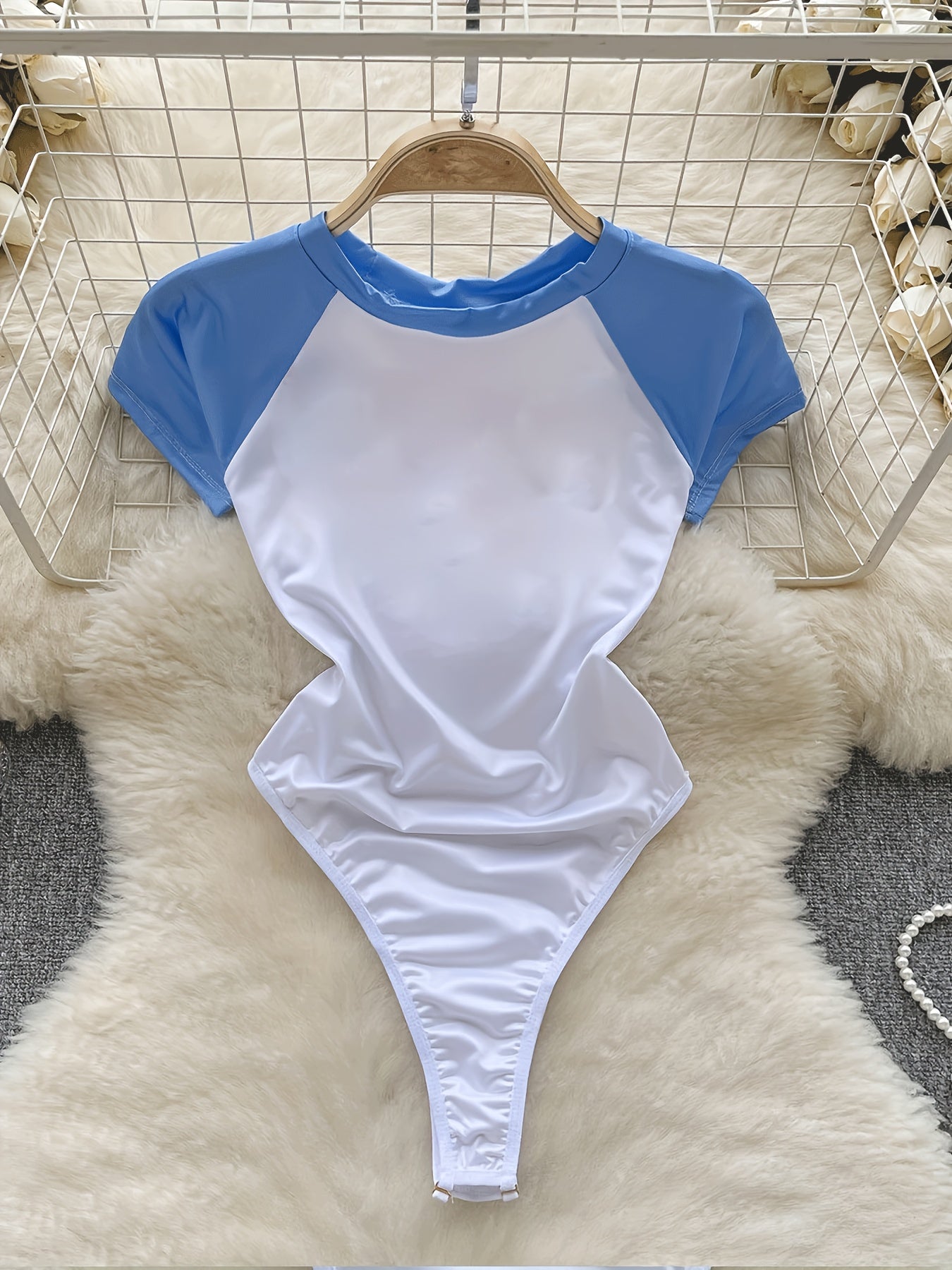 Adult female bodysuit with random print, polyester and spandex blend, party style, one size fits all.