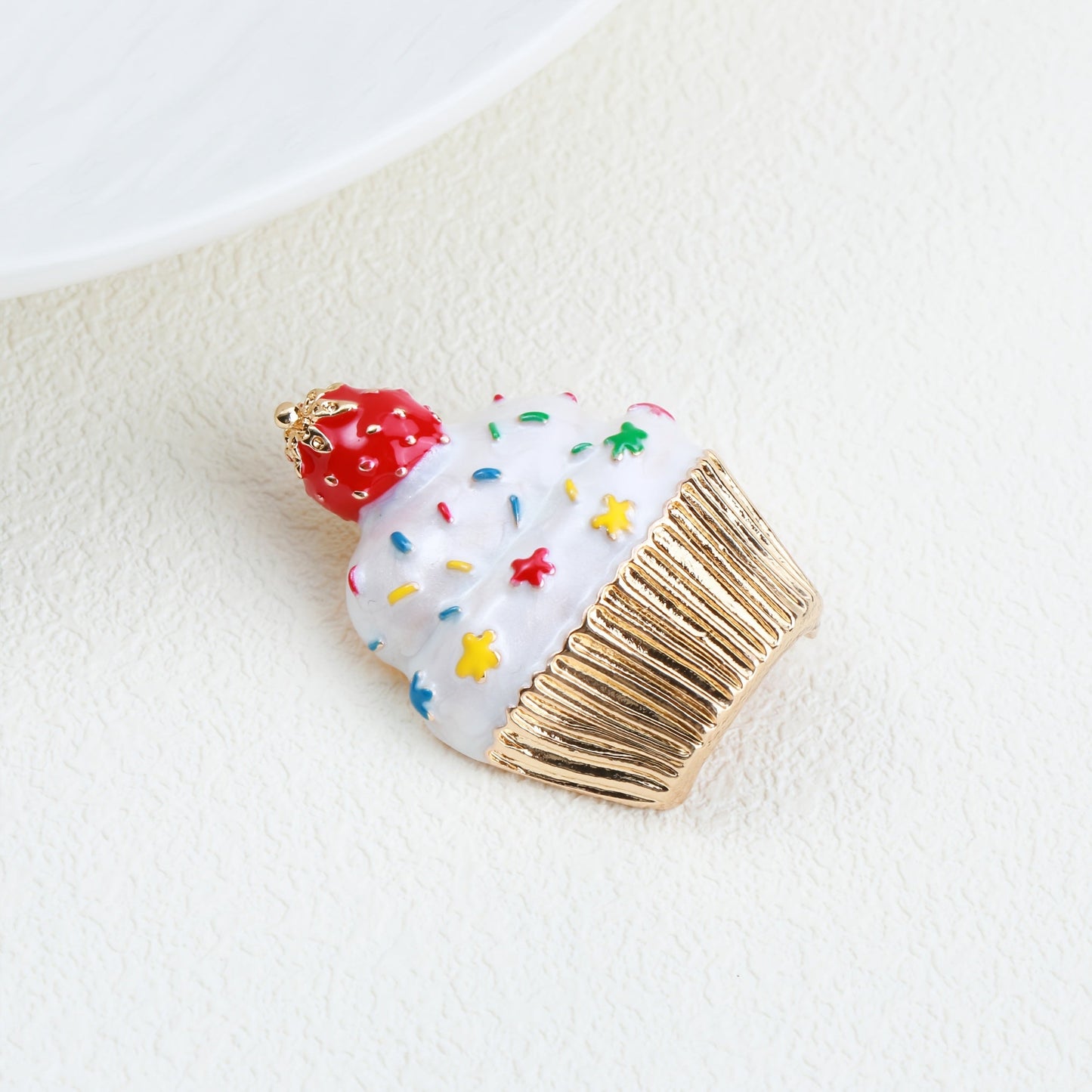 Add some festive flair to your holiday outfits with this adorable Cute Christmas Cupcake Brooch Pin. Crafted from enamel, this accessory is the perfect way to spread holiday cheer wherever you go.