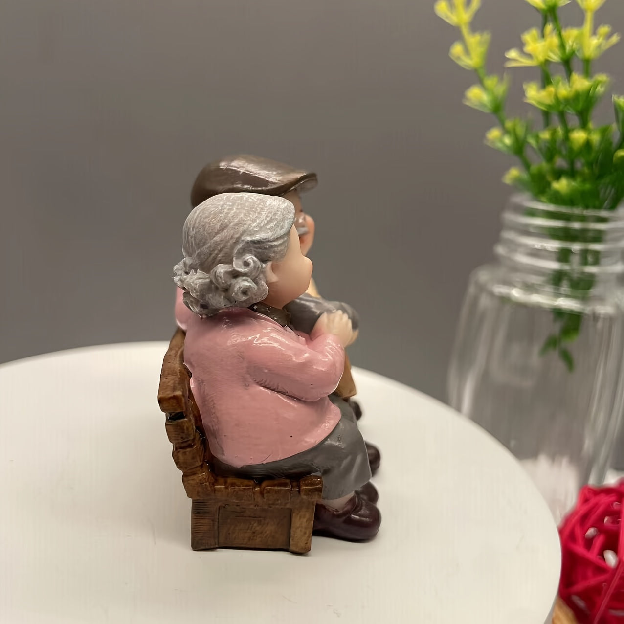 Resin figurine of charming elderly couple, ideal for home or office decor. Perfect Valentine's Day or anniversary gift.