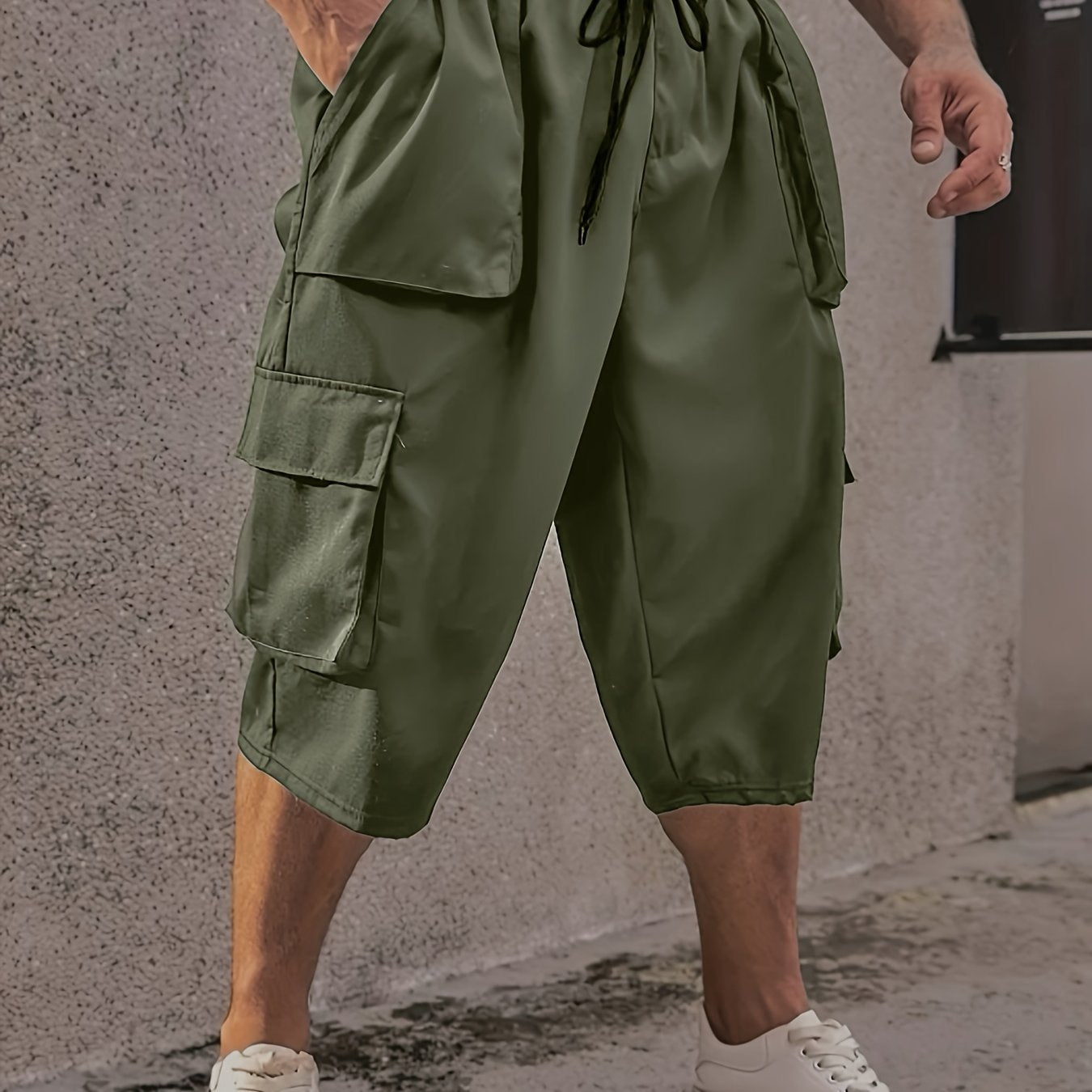 Men's plus size cargo pants with drawstring and pockets, loose fit, and comfortable breathability.