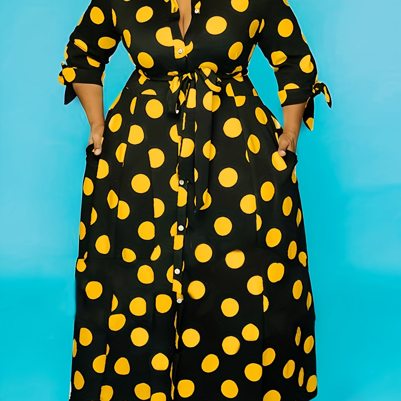 Women's plus size polka dot print maxi dress with collared button-up front and belted waist.