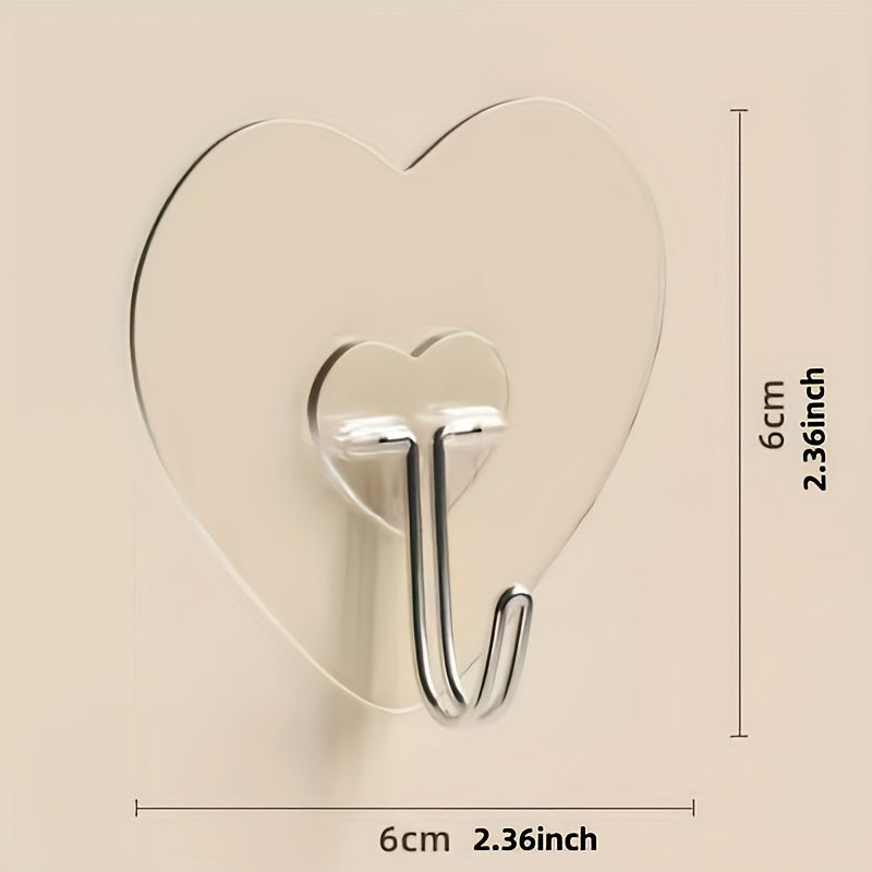 10-pack of heavy-duty adhesive hooks with clear plastic suction cups, heart-shaped wall mounts for kitchen and bathroom storage. Easy to install and perfect for casual style utility hooks.