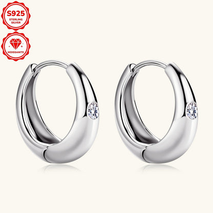 These stylish women's hoop earrings are crafted from 925 sterling silver and adorned with 2.5mm Mozambique stones. The simple yet fashionable design features a circular shape, weighing a total of 4.36g in silvery color. Each earring is embellished with 2