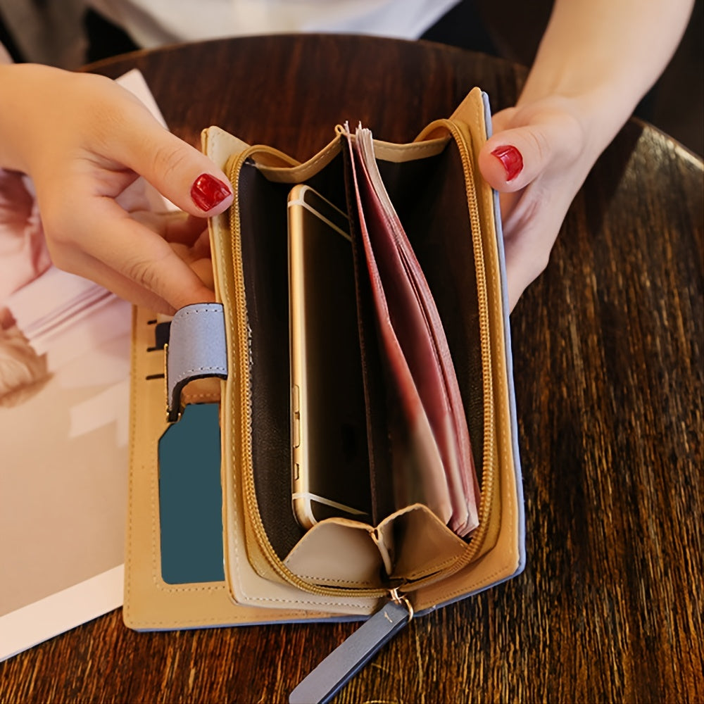 Black synthetic leather women's wallet with golden leaf design, featuring card holders, coin pouch, and snap closure.